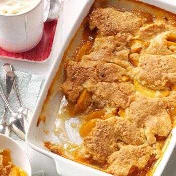 Peach cobbler in a white dish