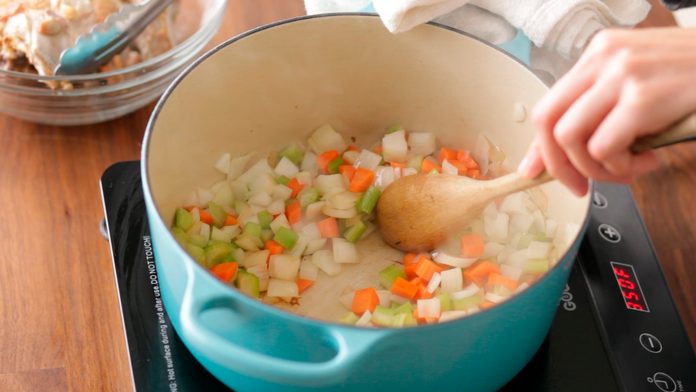 Diced vegetables in a stockpot