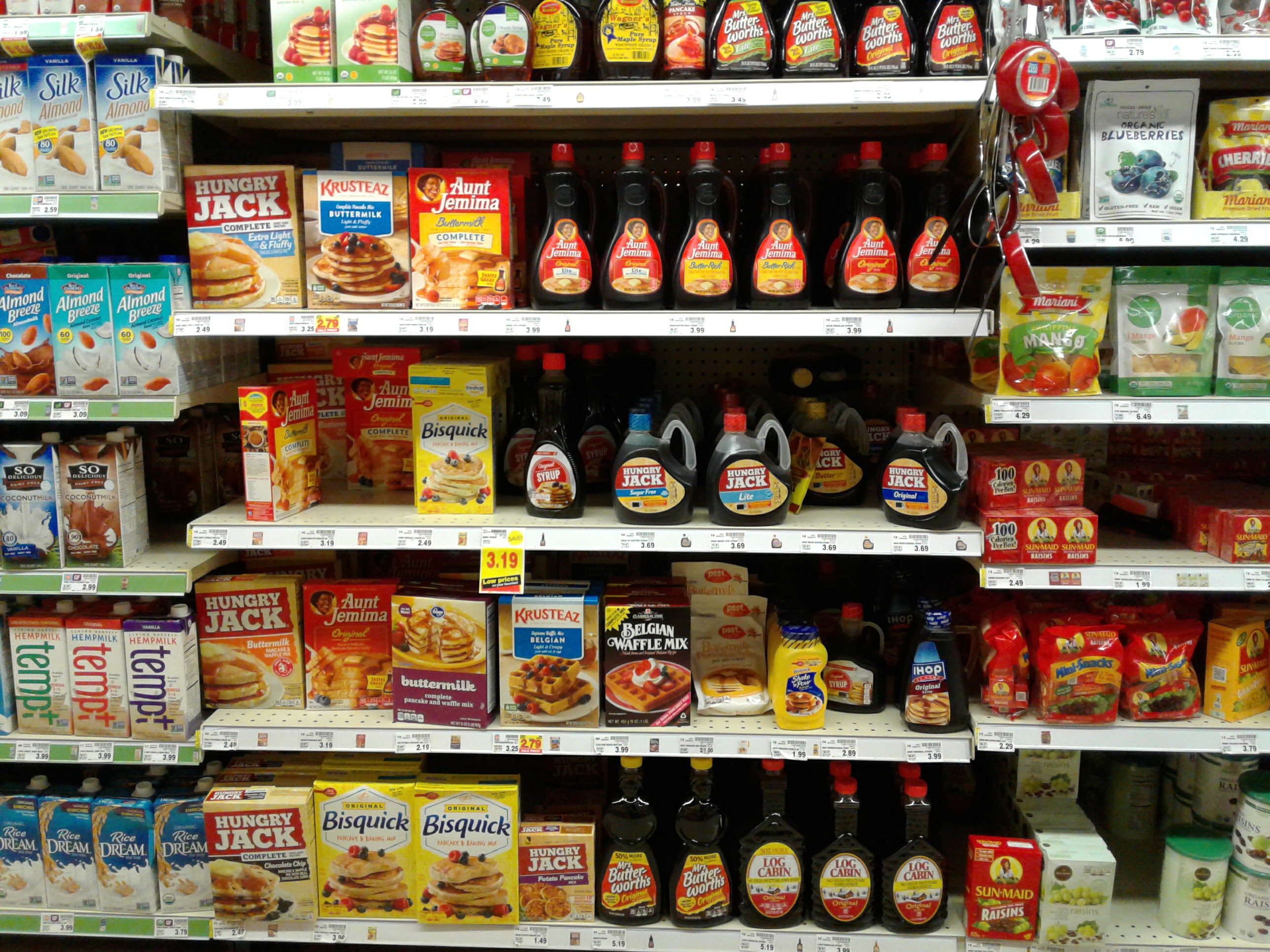 Grocery store shelf of maple syrups