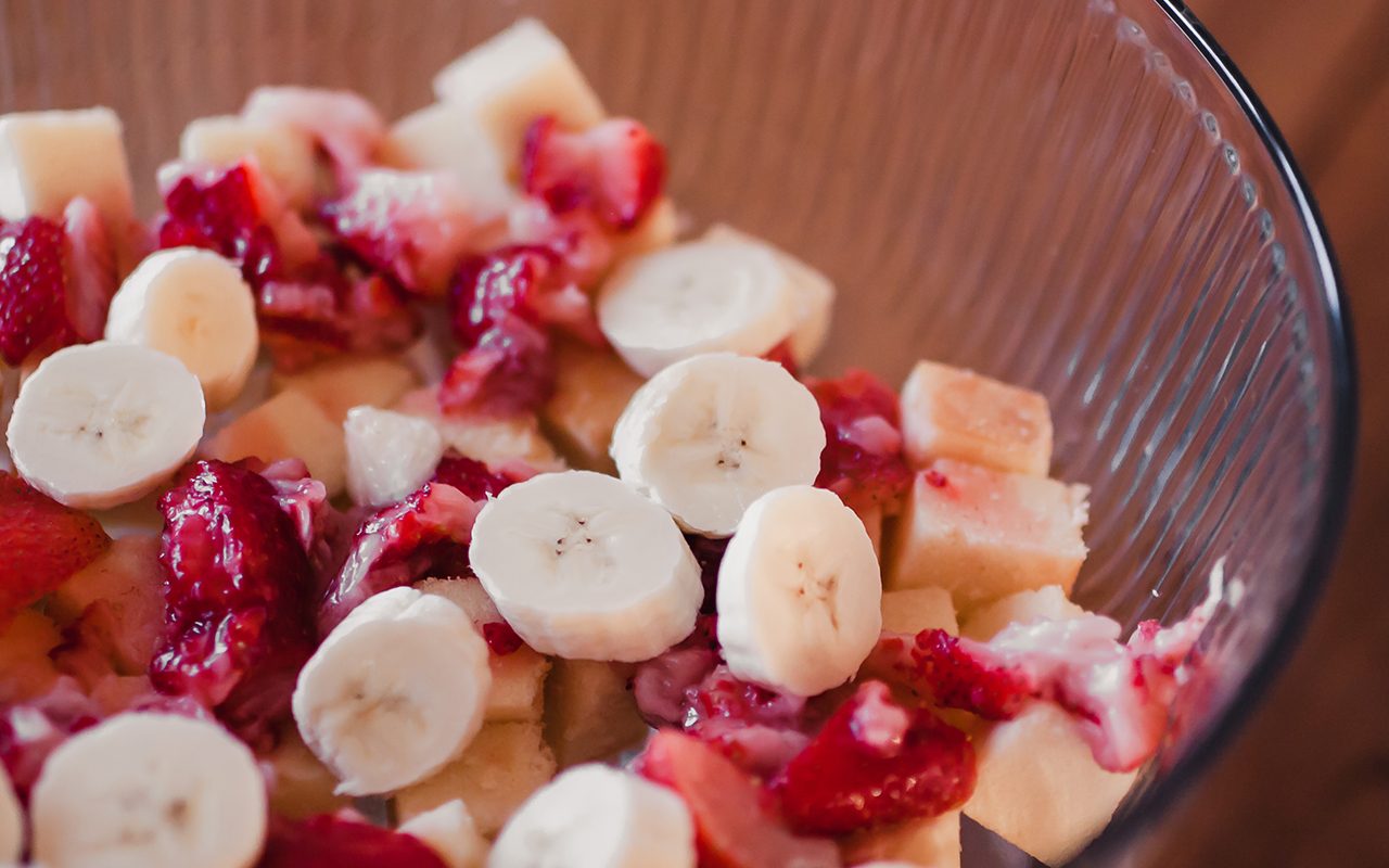 Layer two of strawberries and bananas - how to make trifle