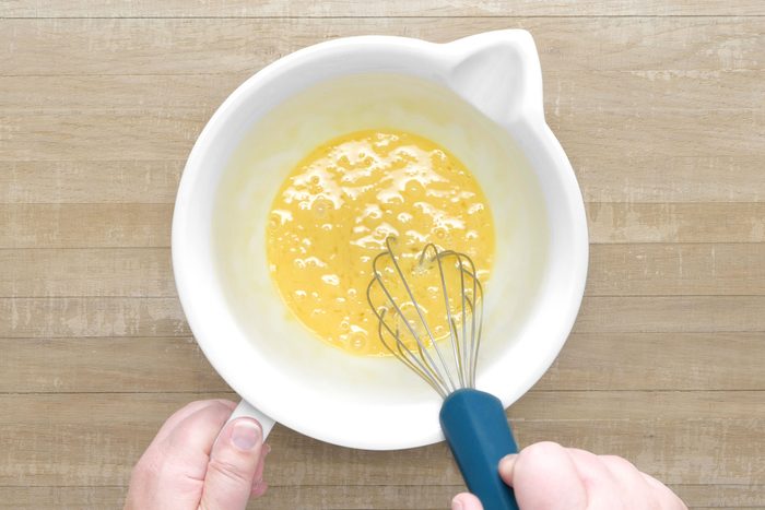 Whisking the eggs in a large bowl