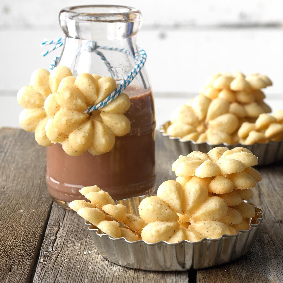 Cardamom Spritz cookies served in a cookie tin