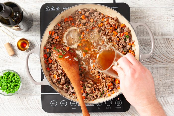 Adding liquid to meat mixture