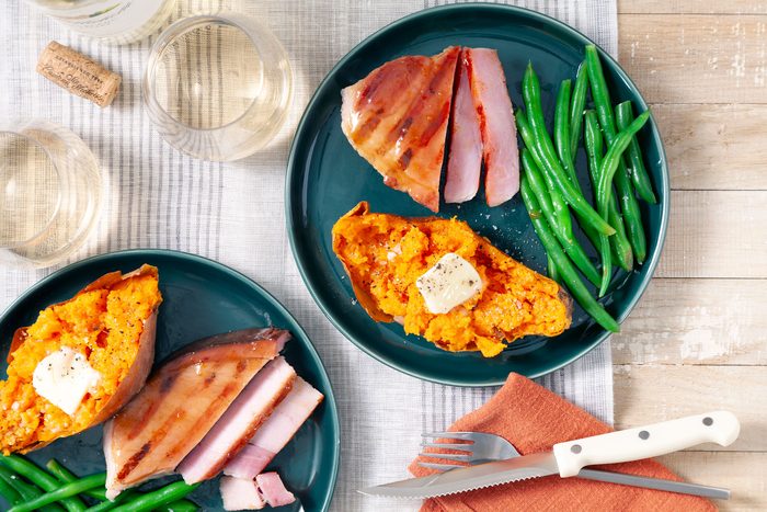 Grilled Ham Steak with Green Beans Served in Green Ceramic Plate