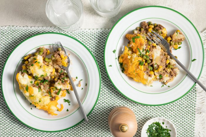 Skillet Shepherd's Pie in two small ceramic plates with forks