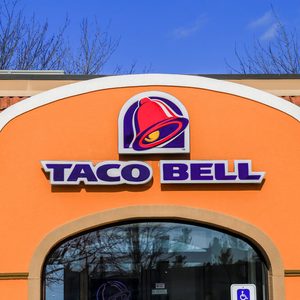 Exterior of Taco Bell fast-food restaurant with sign and logo