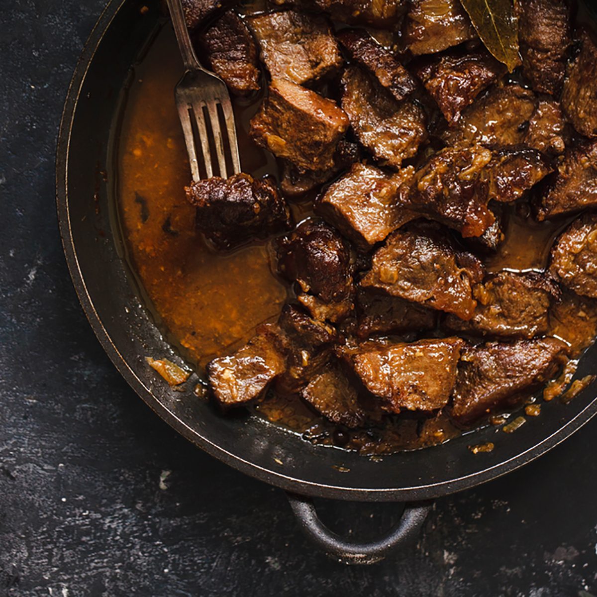 Beef meat stew. Overhead view braised beef meat stew with vegetables in pot.; Shutterstock ID 496497469; Job (TFH, TOH, RD, BNB, CWM, CM): Taste of Home