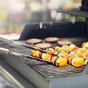 Closeup of grilled shashliks on grate