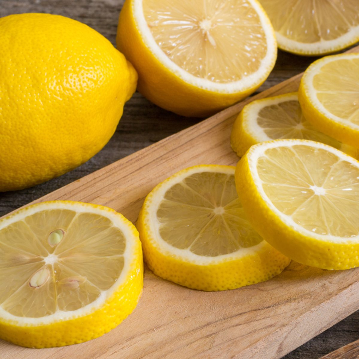 Lemon slices on the old wooden table.