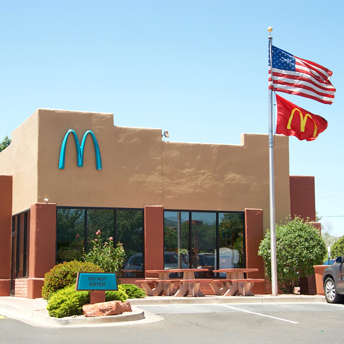 Sedona, AZ - May 13, 2017: McDonald's in Sedona, AZ is the only one in the world with turquoise arches. City officials said to feel the yellow would contrasting too much against the scenic red rock.; Shutterstock ID 643234660