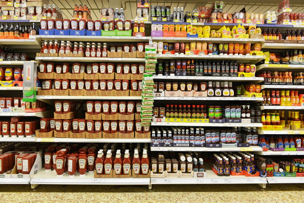 London, UK - December 12, 2014: Shelf view of a Tesco supermarket store. Britain's Tesco supermarket chain is the world's third largest retailer after America's Walmart and France's Carrefour.; Shutterstock ID 237256429