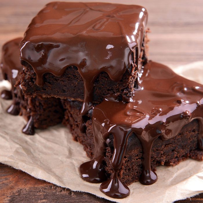 Delicious chocolate cakes on table close-up