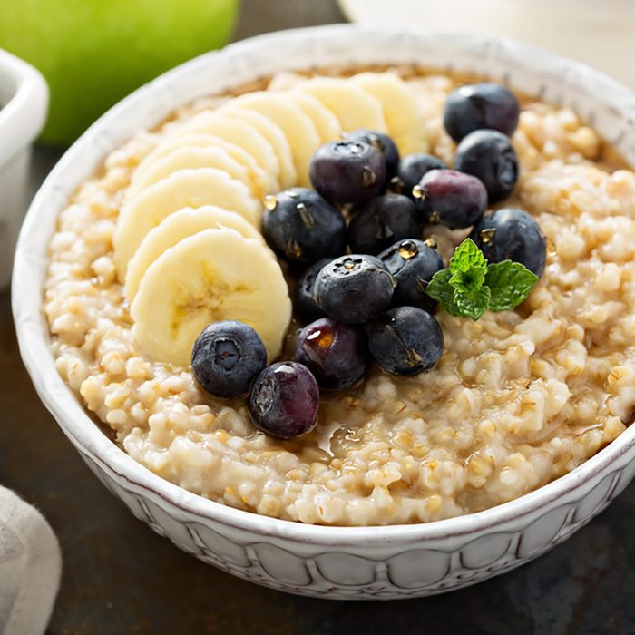 Steel cut oatmeal porridge with banana and blueberry for breakfast