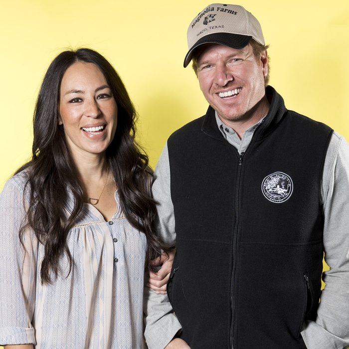Joanna Gaines, left, and Chip Gaines pose for a portrait in New York to promote their home improvement show, "Fixer Upper," on HGTV
