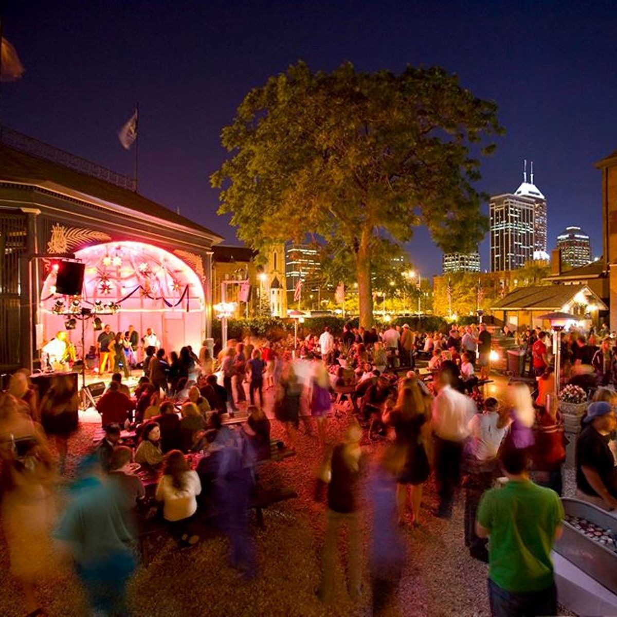 People enjoying a concert and drinks at The Rathskellar's beer garden