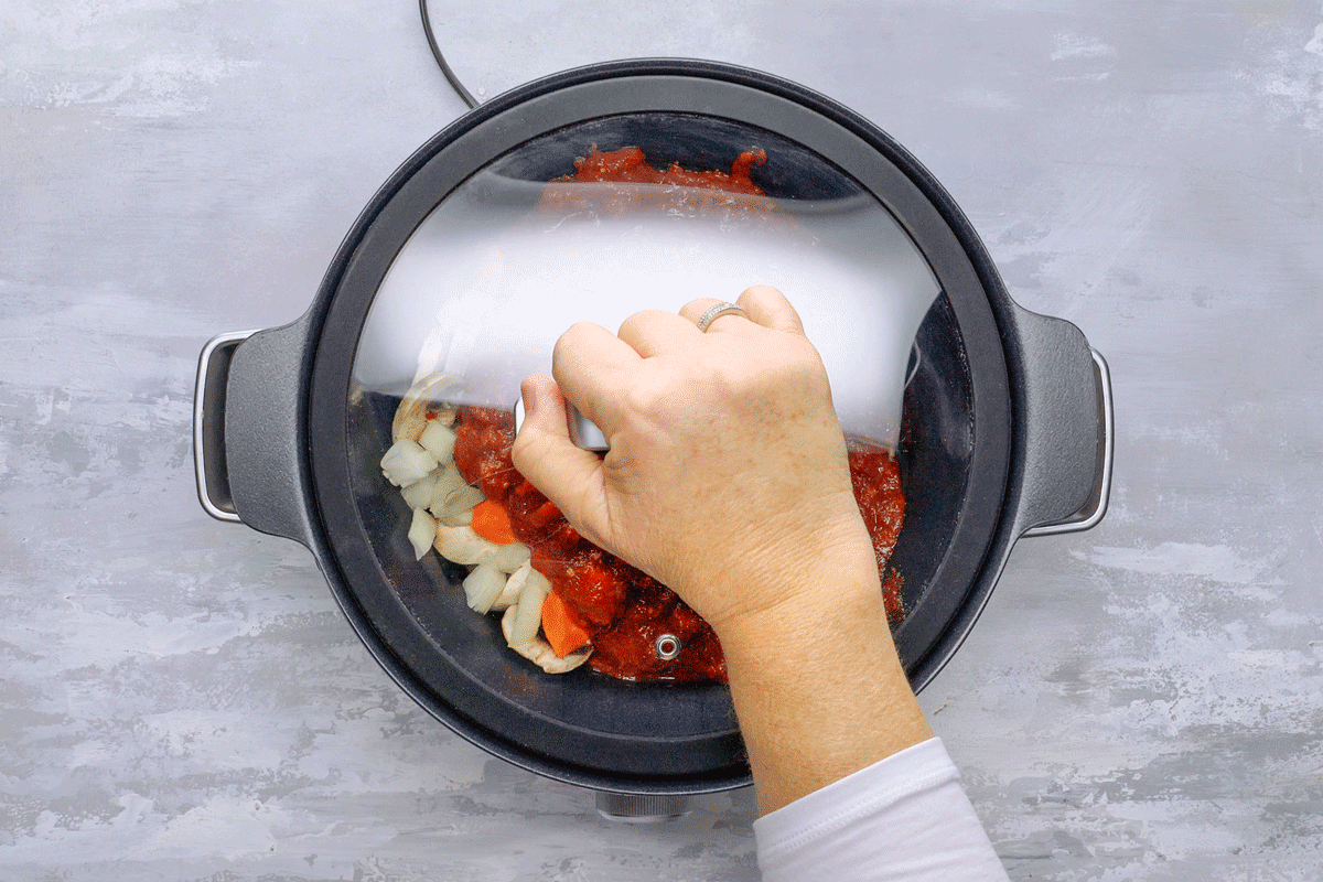 Sauce and beef is cooked in a slow cooker