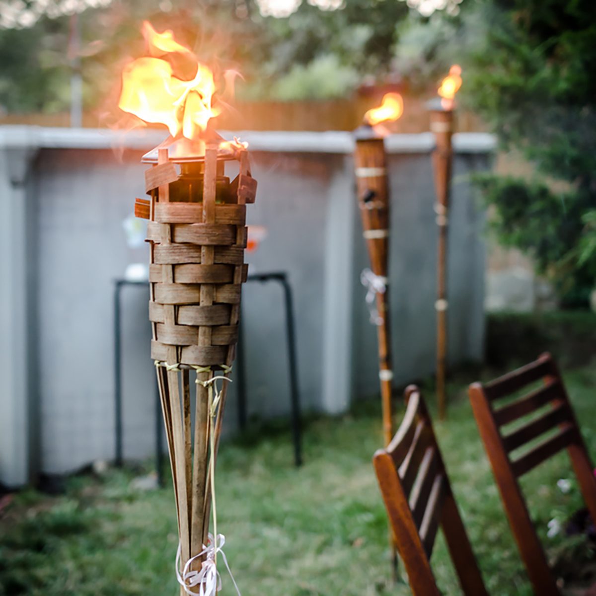 Burning tiki torch in the backyard