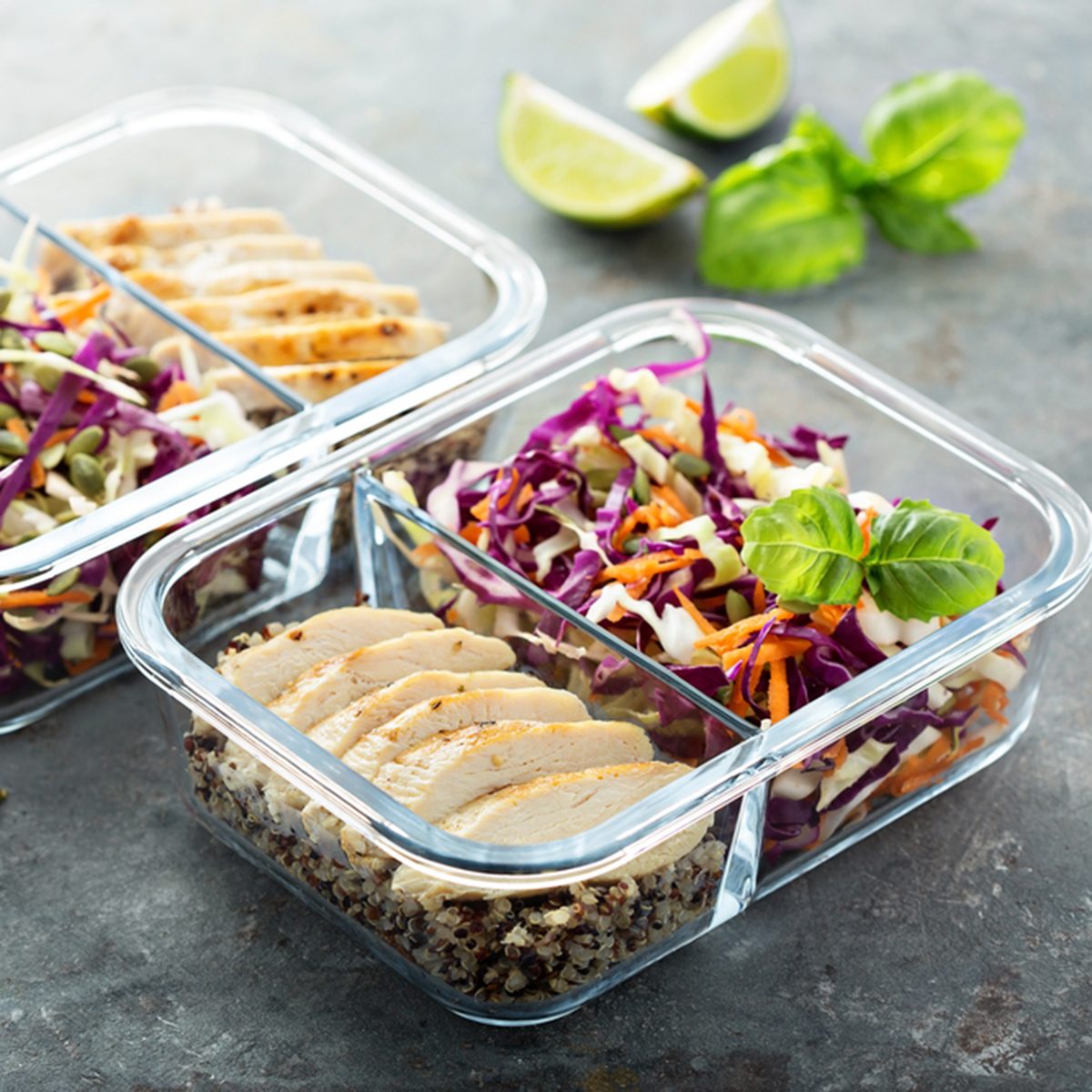 Healthy meal prep containers with quinoa, chicken and cole slaw