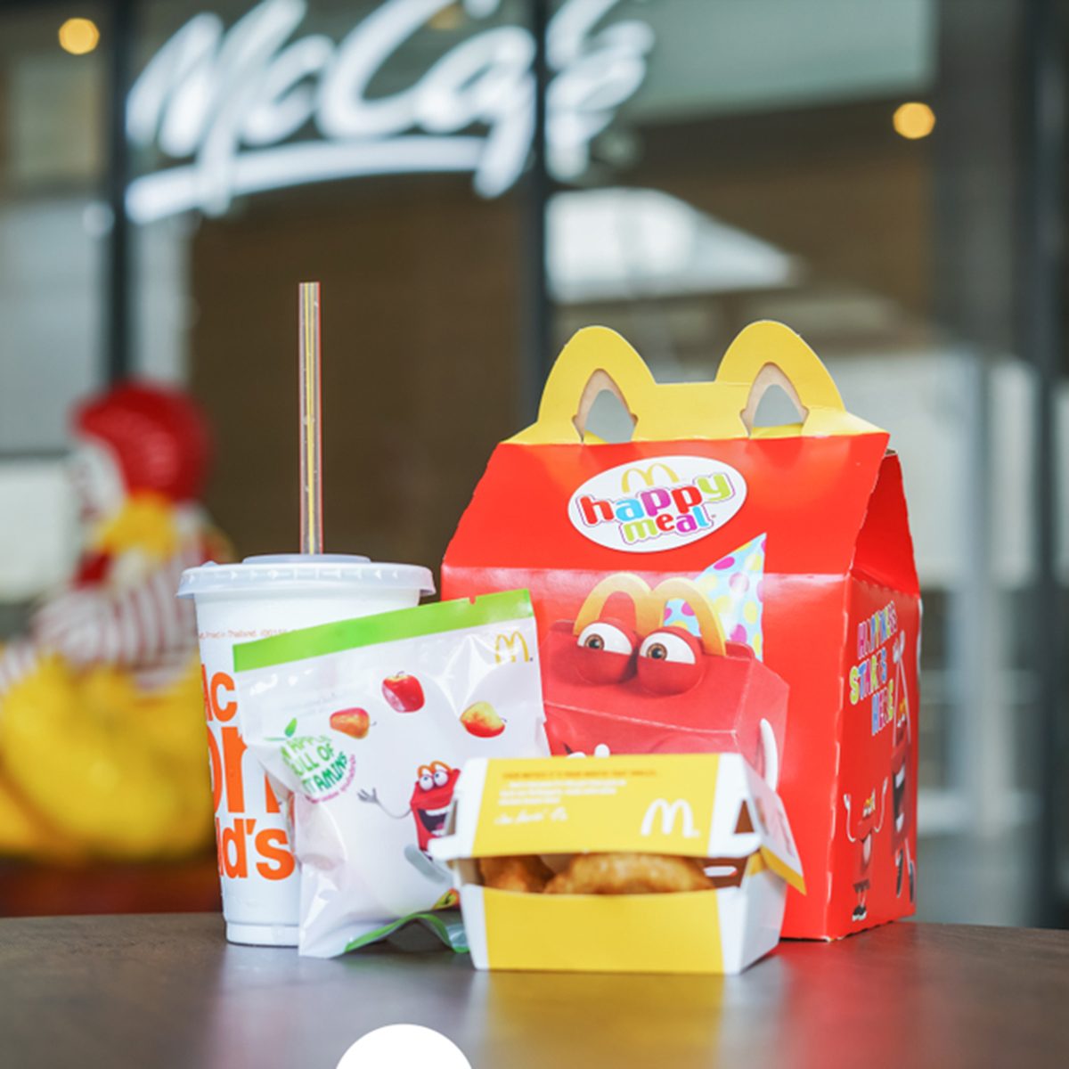 BANGKOK,THAILAND - JANUARY 9,2018 : Happy meal set on desk ,in soft focus, with blurred Ronald McDonald at McDonald's restaurant; Shutterstock ID 1013839621; Job (TFH, TOH, RD, BNB, CWM, CM): Taste of Home