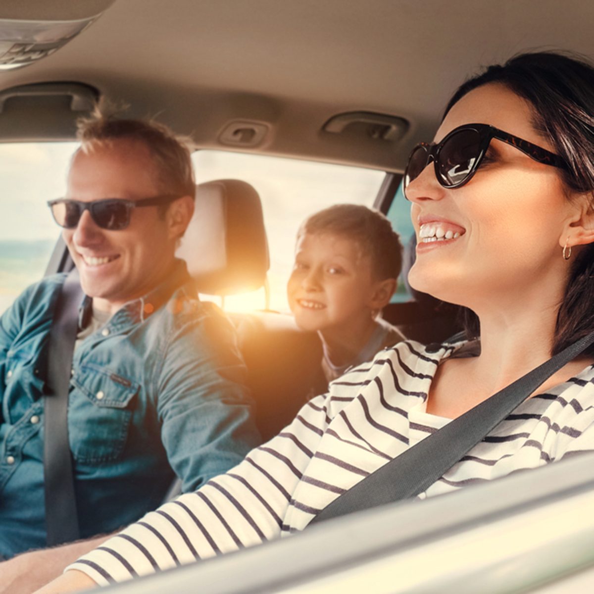 Happy family riding in a car
