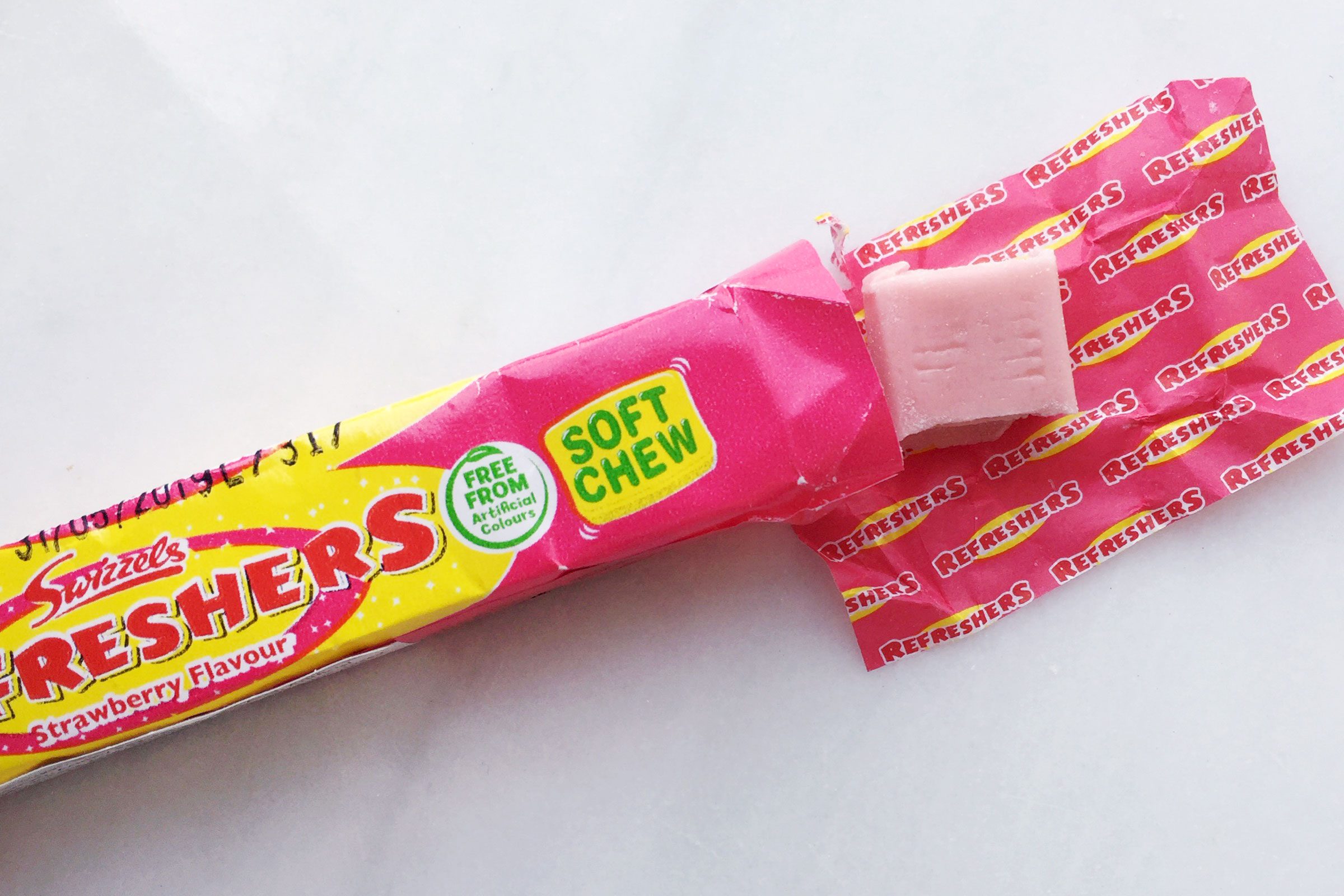 Refreshers candy on a marble surface