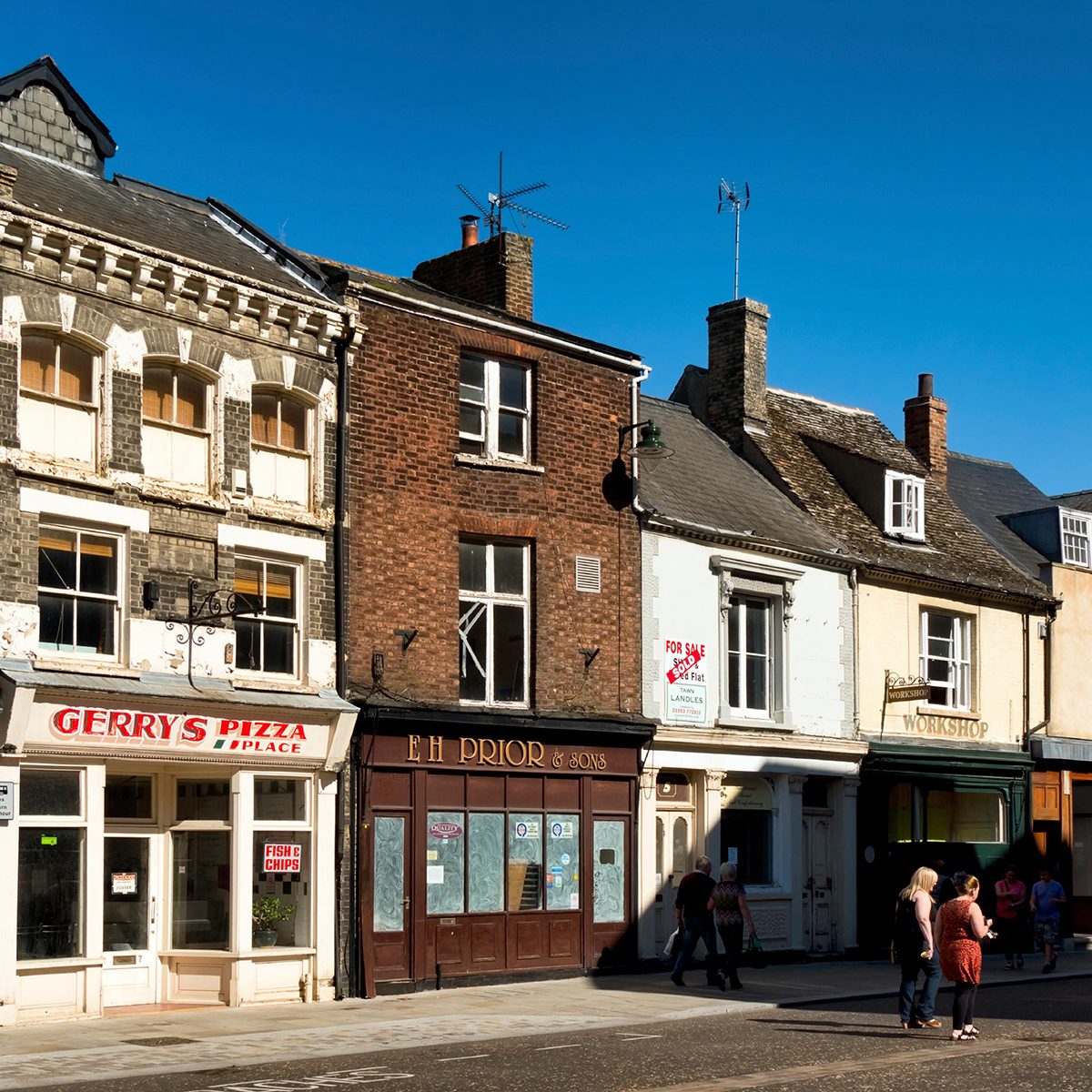 Line of buildings including pizza shop