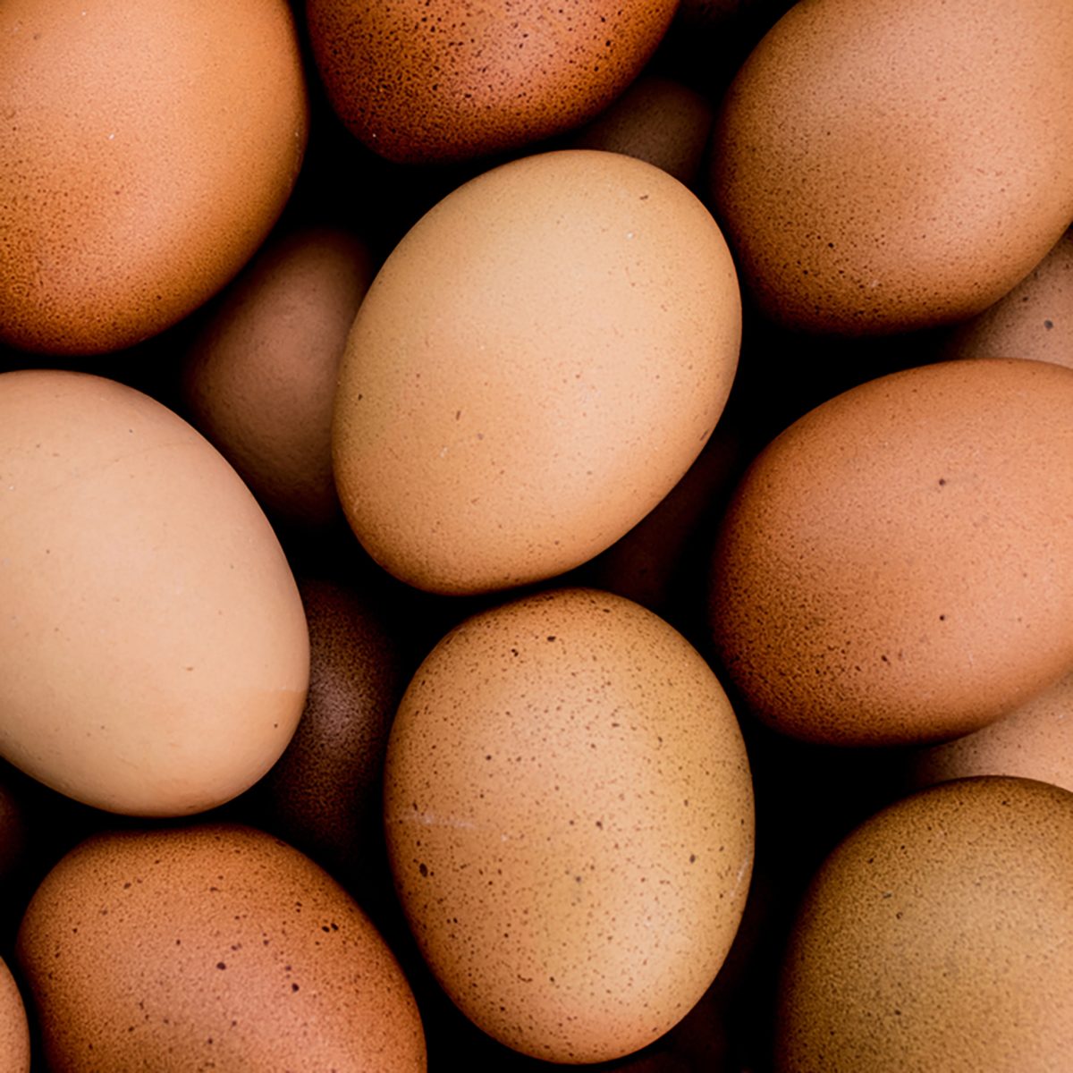 Closeup many of hens eggs with selective focus
