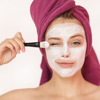 Woman with a yogurt face mask