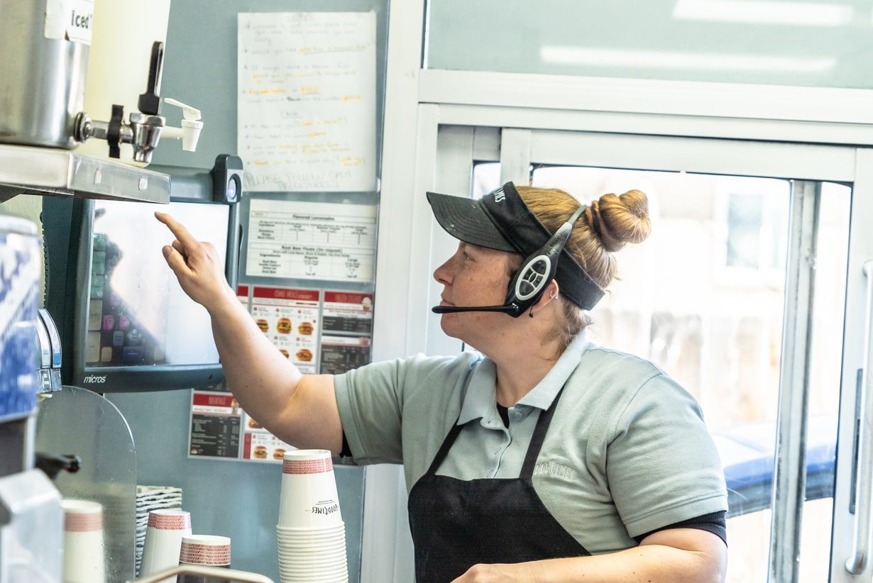 Employee fulfilling a drive-thru order