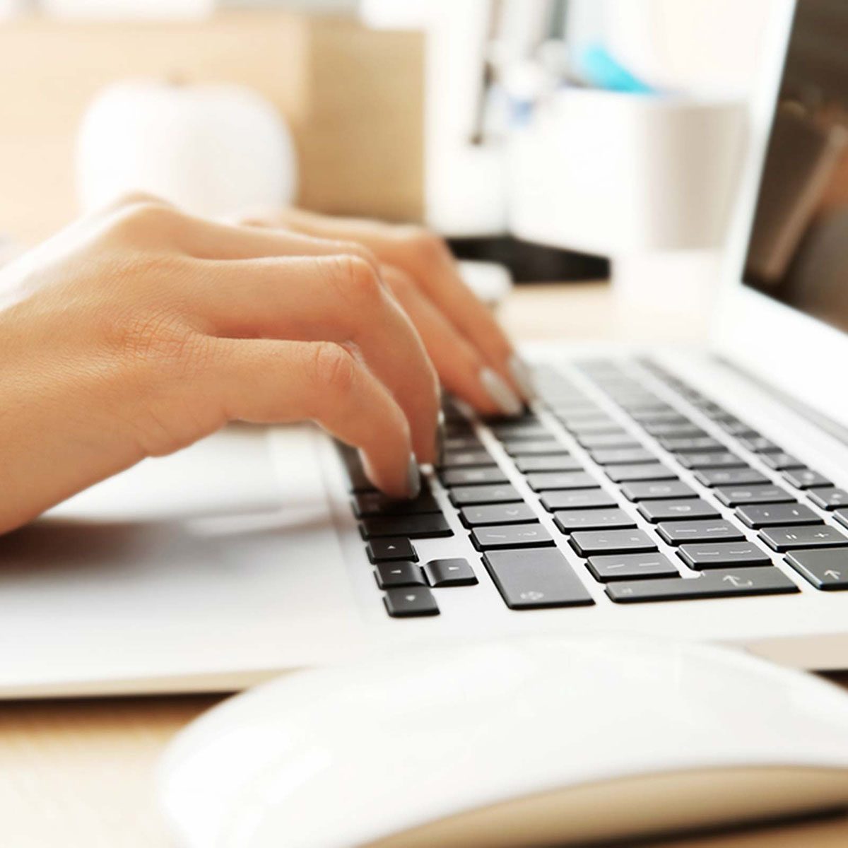 Typing on a laptop