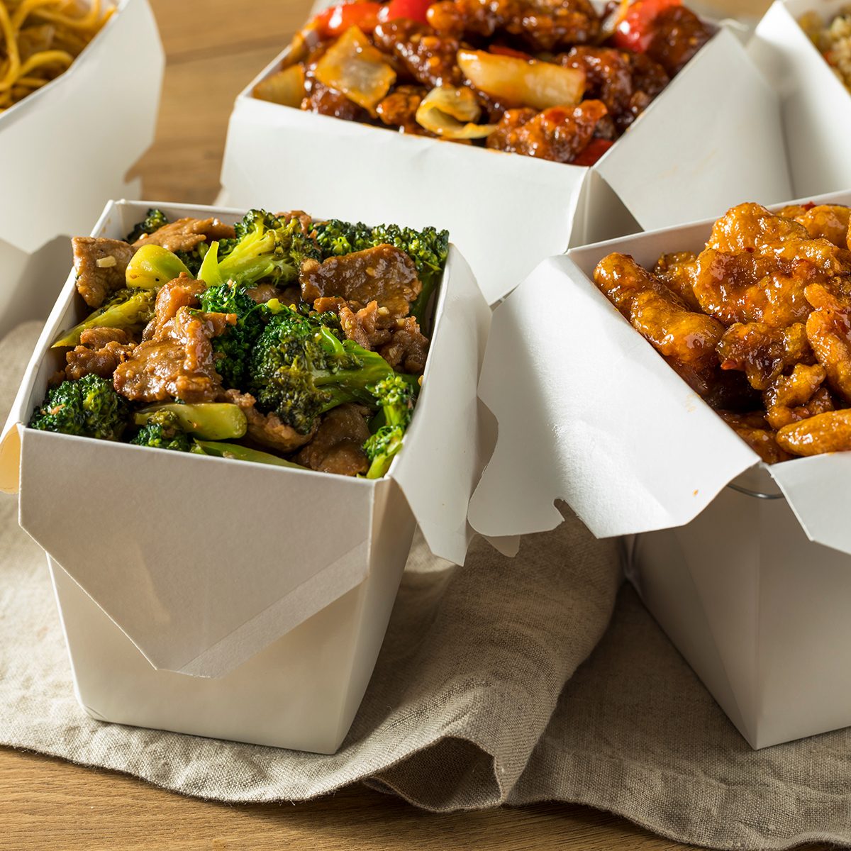 Spicy Chinese Take Out Food with Chopsticks and Fortune Cookies