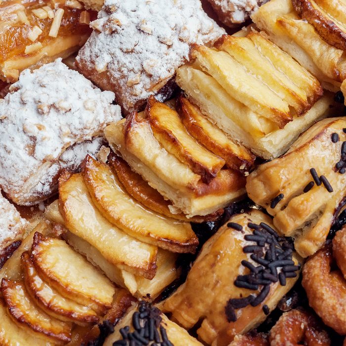 Sweet pastry, puff pastry with powdered sugar, with pine nuts, with jam made from Siam pumpkin, puff pastry with roasted apples and with baked apples.