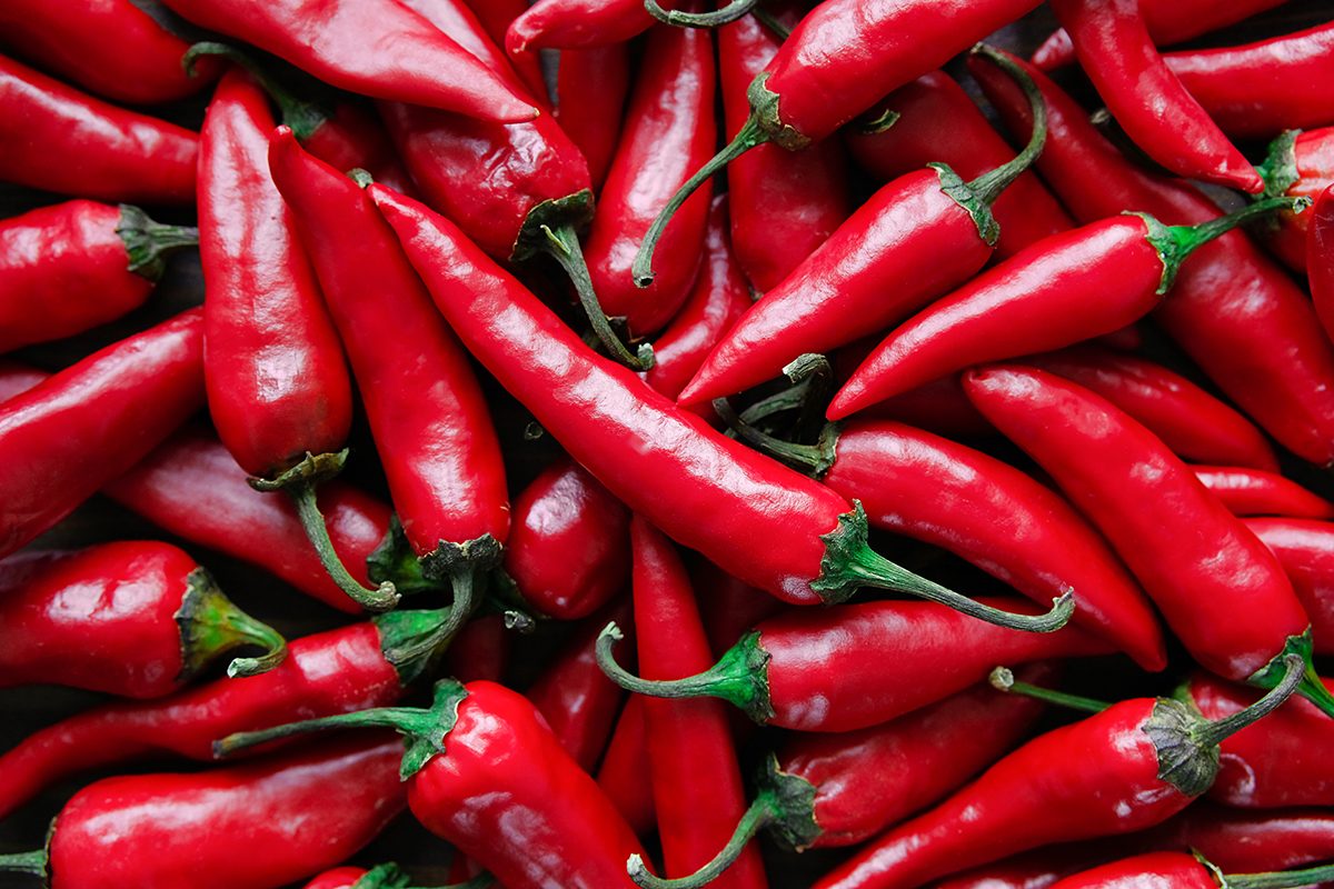 Red hot chili peppers. Stack of vegetables.