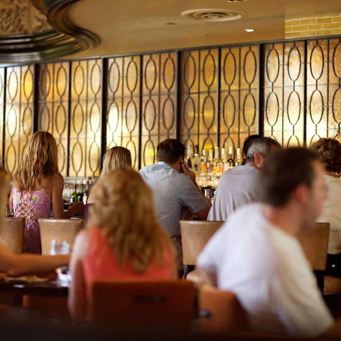 "A shot of crowded bar in fine restaurant. A shallow depth of field is used to blur the faces of crowdsPlease, check out my growing collection of Restaurant images.
