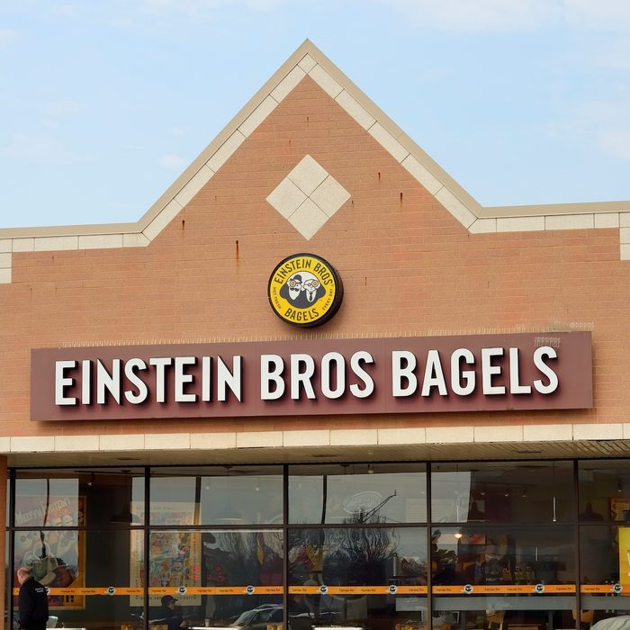"Troy, Michigan, USA - March 6, 2012: The Einstein Bros. Bagels location off John R Road in Troy, Michigan with guests enjoying thir meal and pedestrian passing by. Founded in Colorado, Einstein Bros. Bagels is a chain of bagel and coffee shops with almost 600 locations in the US."