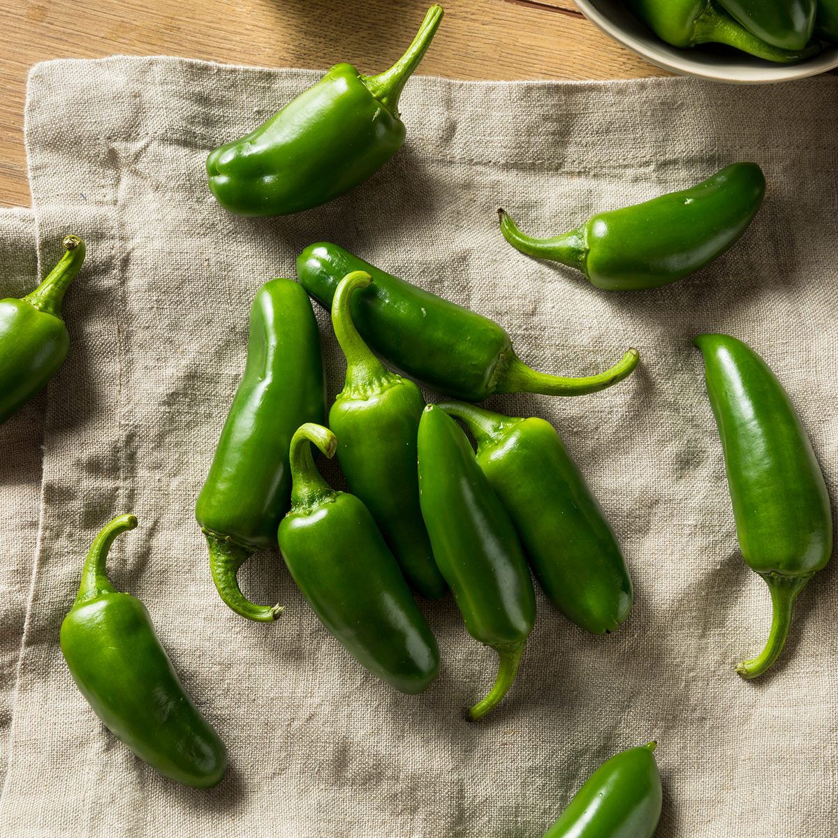 Raw green Organic Jalapeno Peppers Ready to Cook