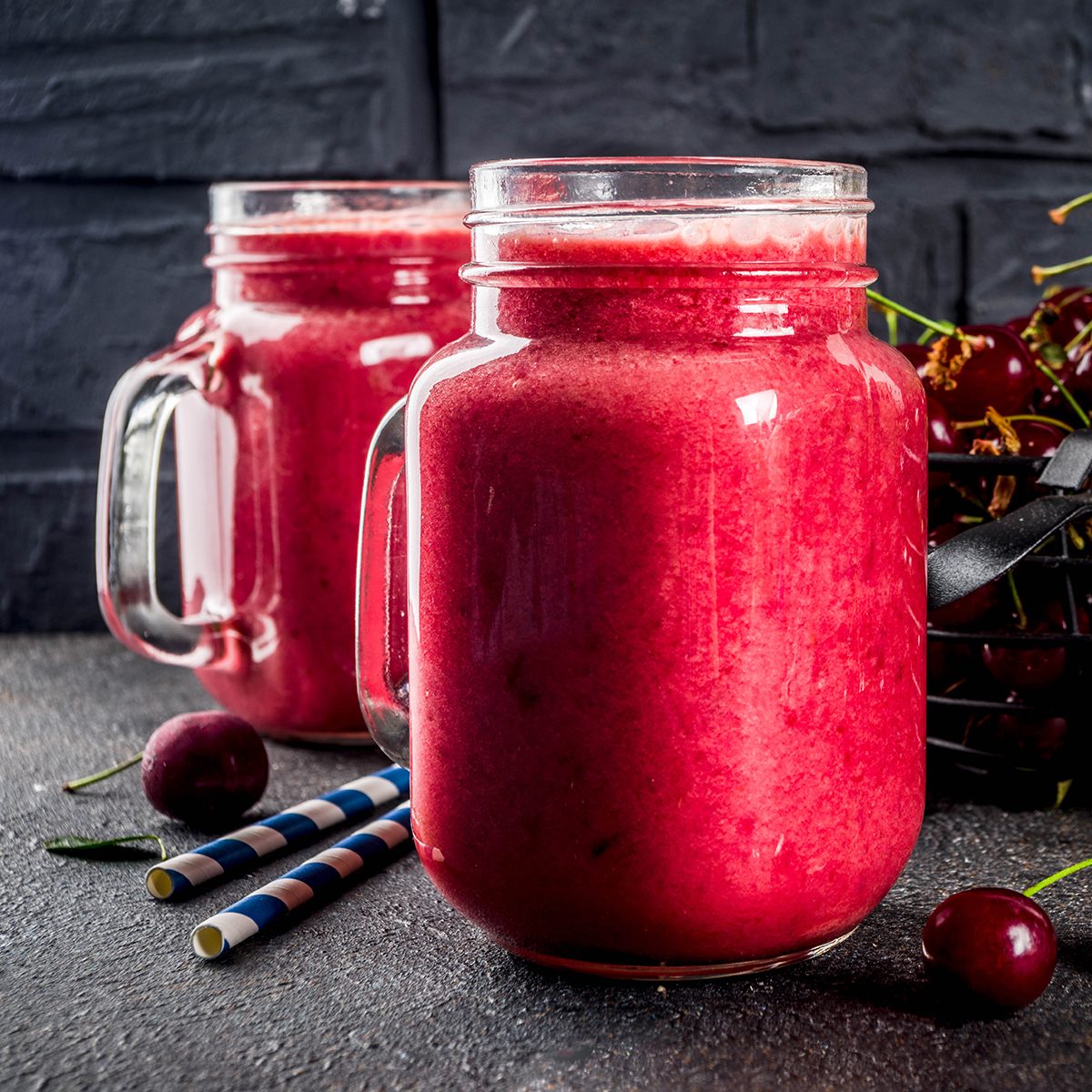 Summer fruity vitamin drink. homemade cherry smoothie on dark background