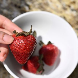 Holding a strawberry