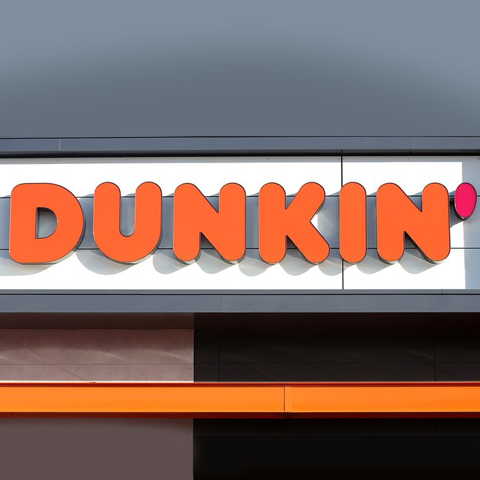 QUINCY, MA - JANUARY 16: A sign outside the new Dunkin' store in Quincy, MA is pictured on Jan. 16, 2018. The famed local chain debuted the new store with "Donuts" removed from its name. Located about 1 mile from where the first one opened in Quincy 68 years ago, this one is decidedly more modern, with an open layout and more natural lighting, a grab-and-go station with healthier options, pickup stations for orders via the mobile app, and eventually, digital kiosks for ordering. (Photo by David L. Ryan/The Boston Globe via Getty Images)