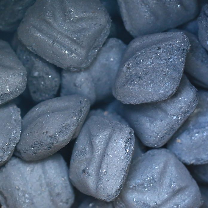 Looking into a bag of charcoal briquettes