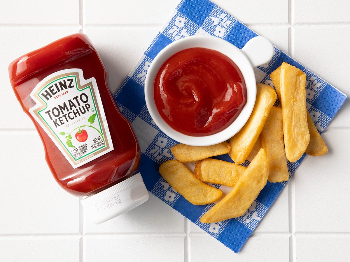 Overhead Shot Of Heinz Ketchup In Bottle With Fries.