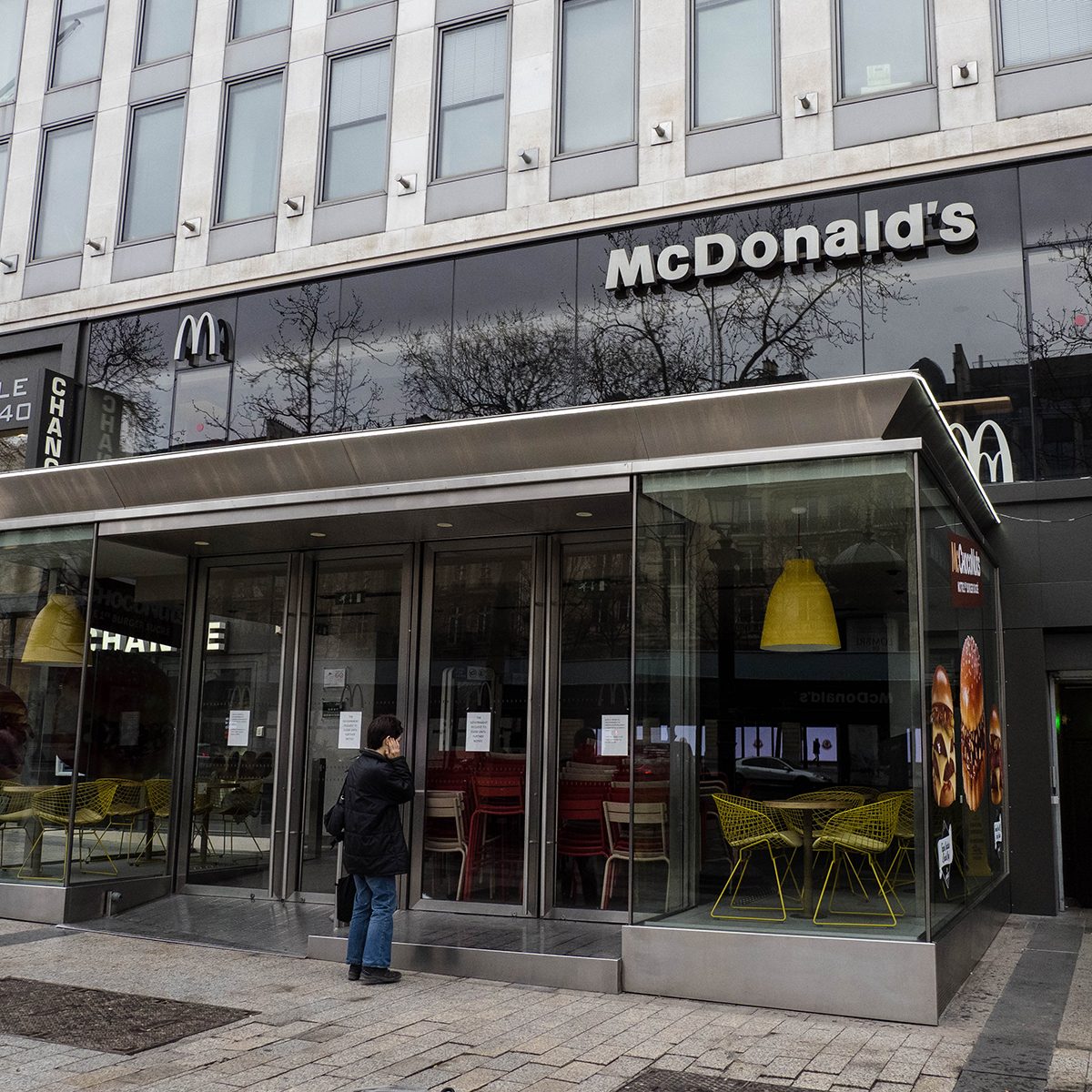 PARIS, FRANCE - MARCH 16: General view of a closed McDonald's restaurant which shows the message "The government requests to close until further notice", at Avenue des Champs Elysees, in the 8th quarter of Paris, as the city imposes emergency measures to combat the Coronavirus COVID-19 outbreak, on March 16, 2020 in Paris, France. French Prime Minister Edouard Philippe announced last Saturday that France must shut shops, restaurants and entertainment facilities to slow down the spread of the coronavirus. Due to a sharp increase in the number of cases of the COVID-19 virus declared in Paris and throughout France, several sporting, cultural and festive events have been postponed or cancelled. The epidemic has exceeded 6,500 dead for more than 169,000 infections across the world. During a televised speech dedicated to the coronavirus crisis on March 16, French President, Emmanuel Macron announced that France starts a nationwide lockdown on March 17. (Photo by Edward Berthelot/Getty Images)
