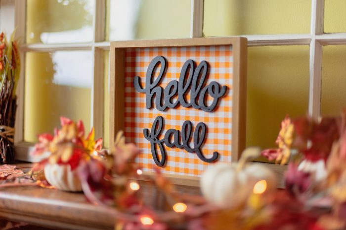 Closeup of orange fall decorations on mantel