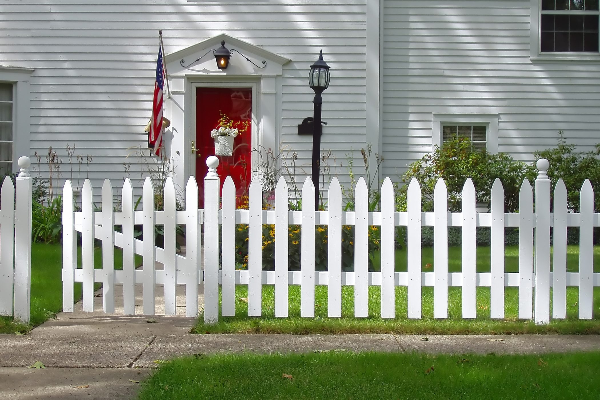 Red Front Door On Colonial Style House