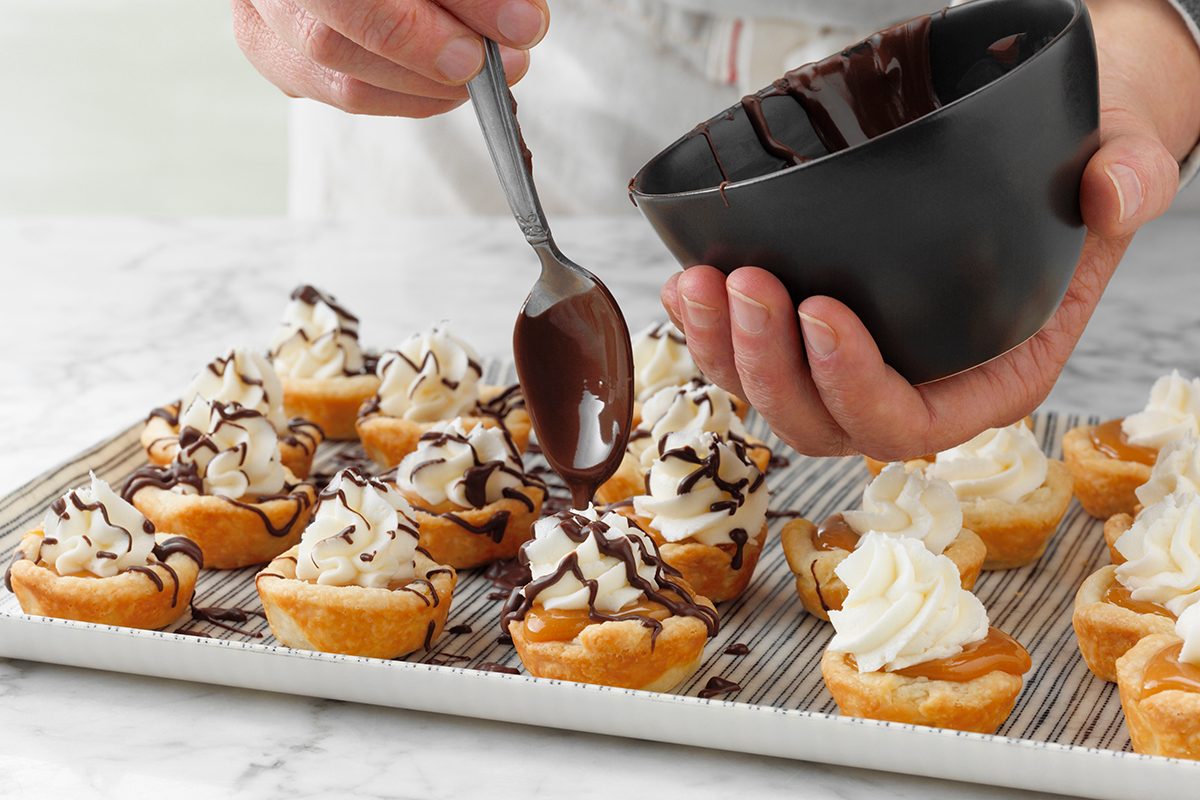 Step 8: Shoe Cups Being Dizzled With Chocolate