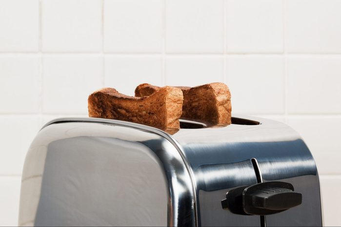 Two slices of toast in toaster