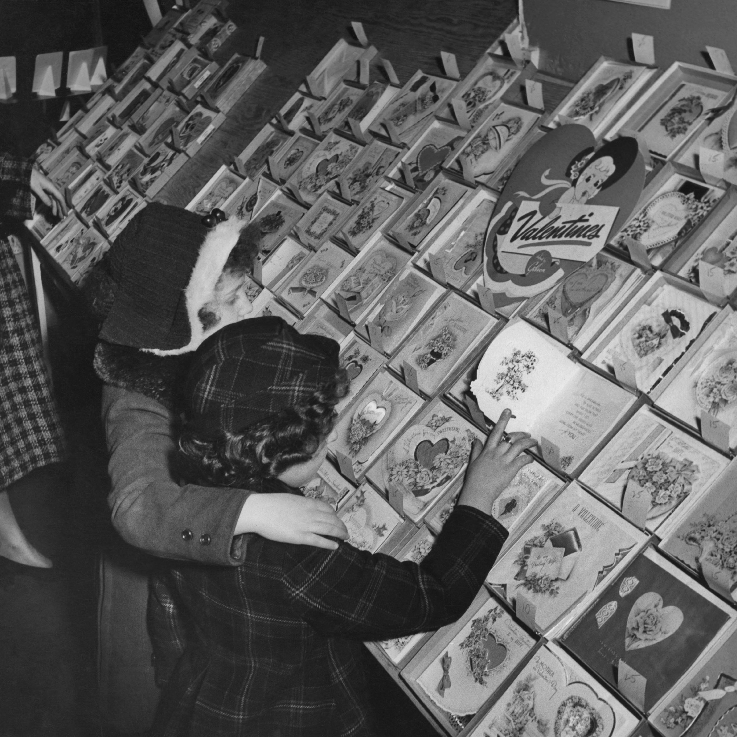 Two little girls browsing at a stall selling a wide range of Valentine's Day 