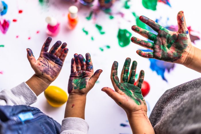 4 Hands covered in paint after a day of painting