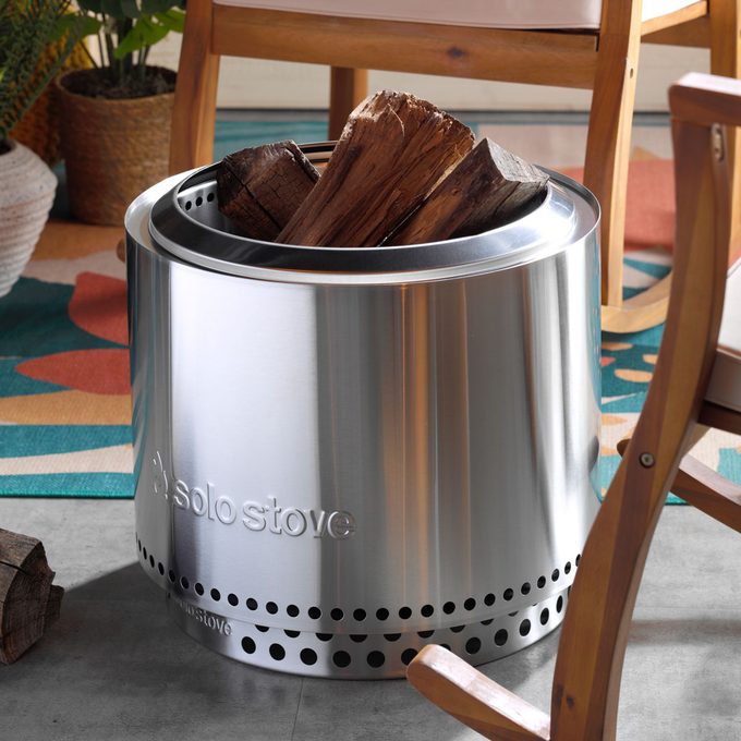 Solo Stove on a Patio With Chairs And Firewood
