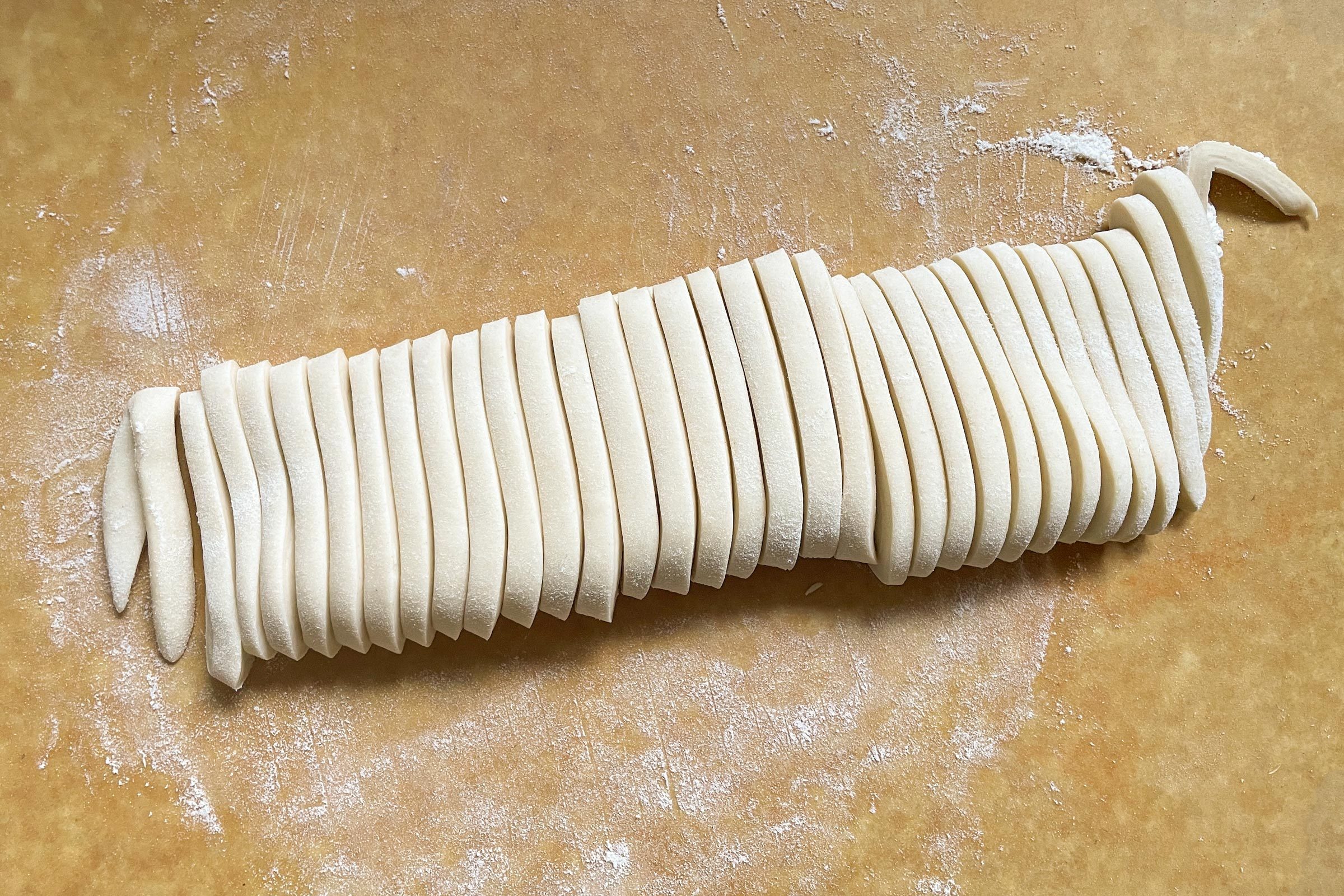 raw udon noodle douch cut into noodle shape
